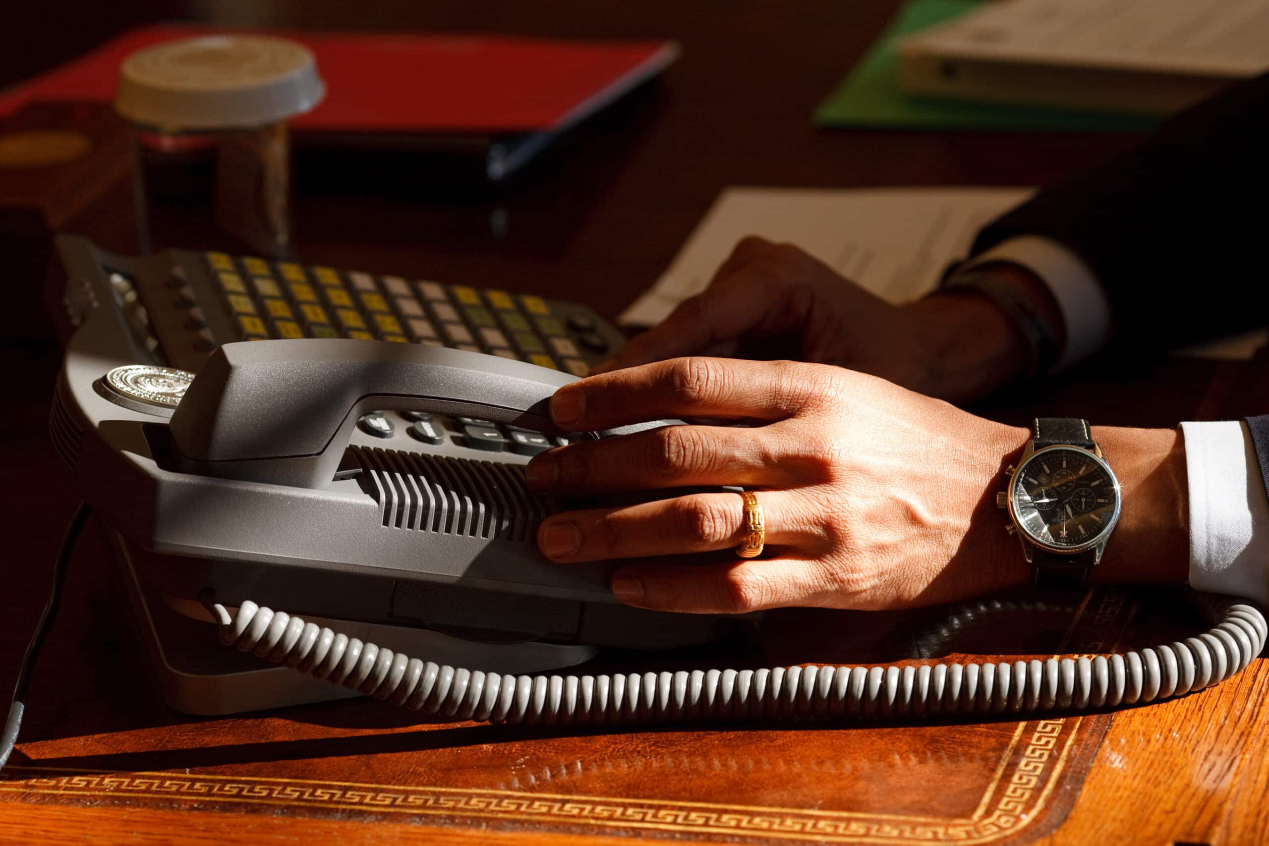 a person using a phone at a desk