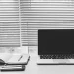 a laptop computer sitting on top of a desk