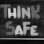 a chalkboard with the words think safe written on it