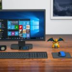 a desktop computer sitting on top of a wooden desk