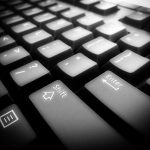 a black and white photo of a computer keyboard