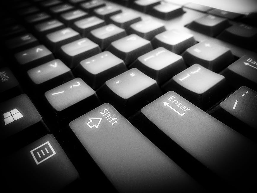 a black and white photo of a computer keyboard