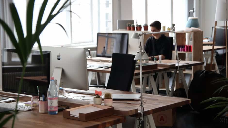 a man sitting at a desk in an office