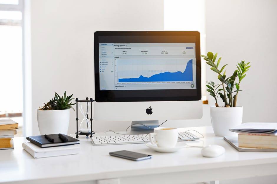 a desktop computer sitting on top of a white desk