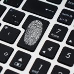 a close up of a keyboard with a fingerprint on it