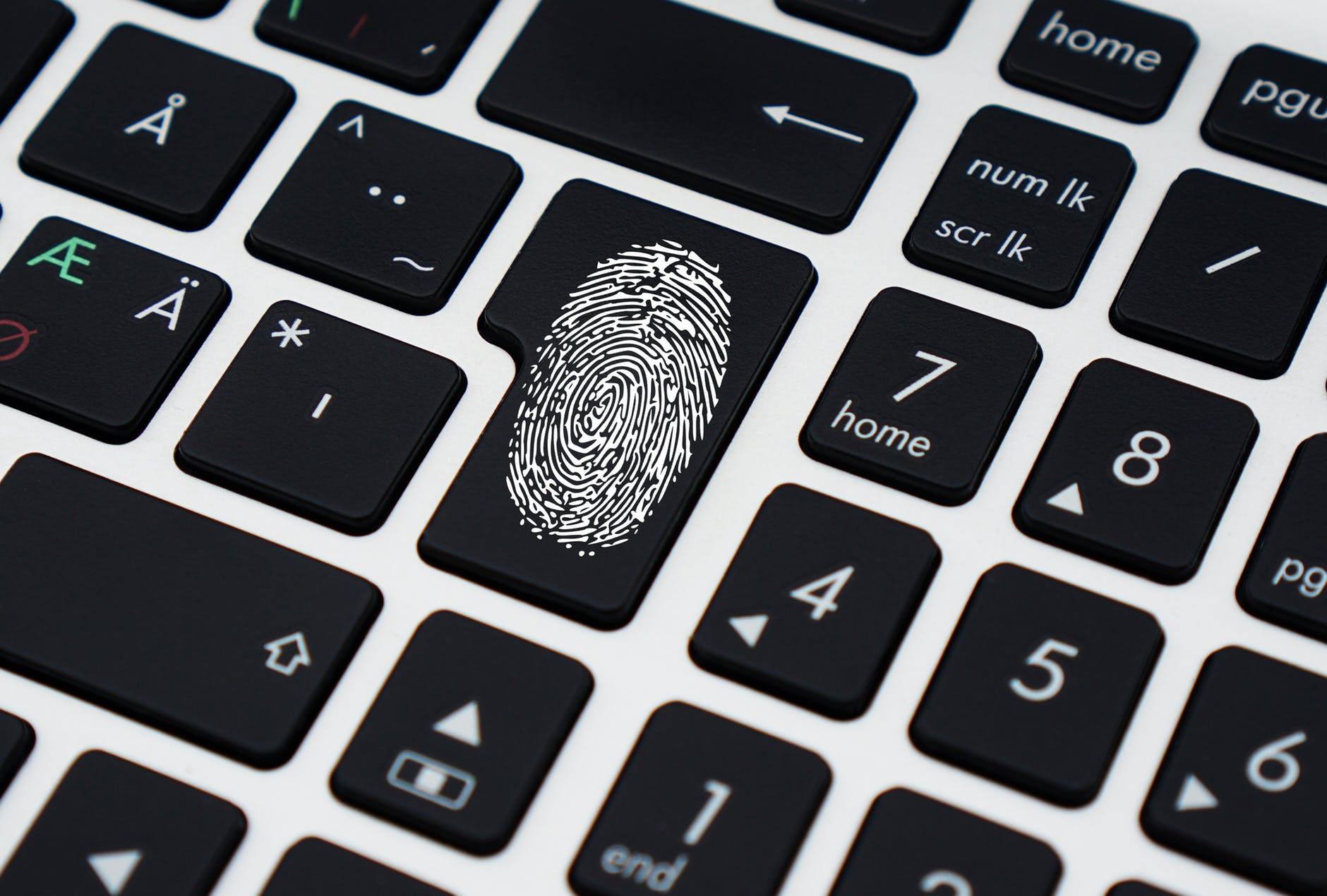 a close up of a keyboard with a fingerprint on it