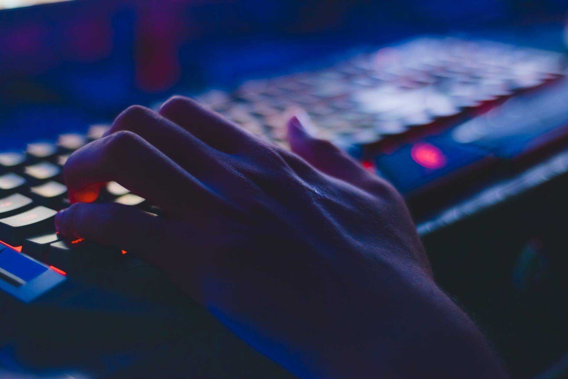 a person is typing on a computer keyboard