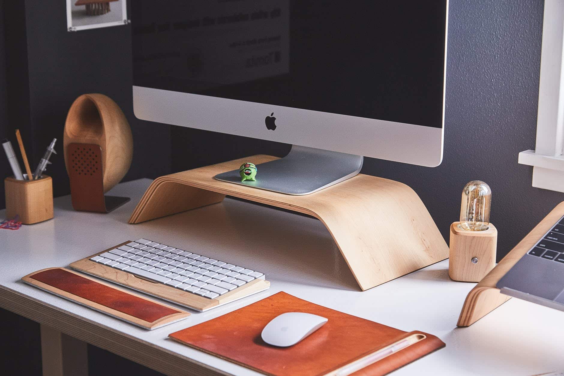 a computer monitor sitting on top of a desk