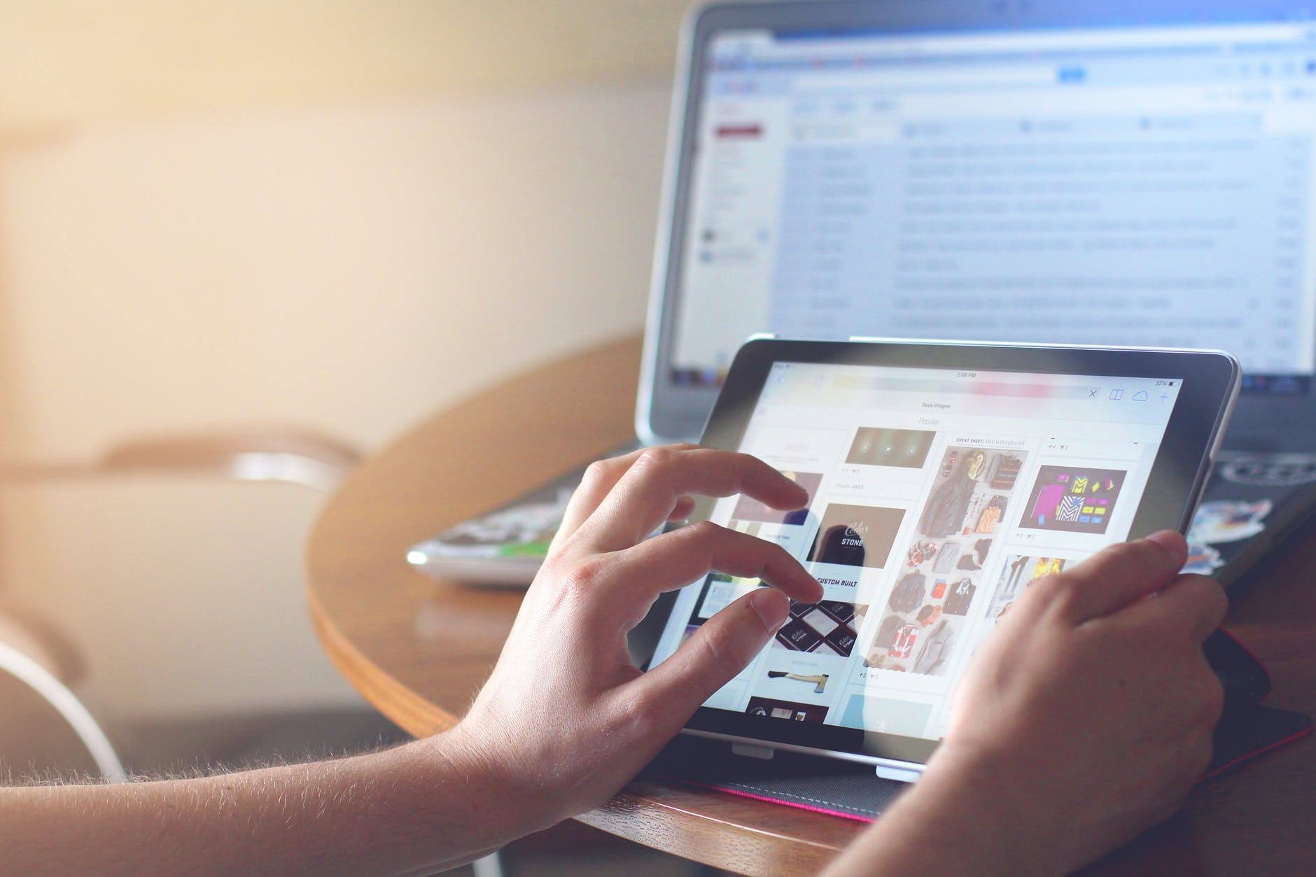 a person using a tablet on a table