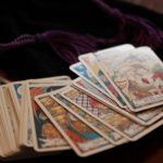 a bunch of playing cards sitting on top of a table