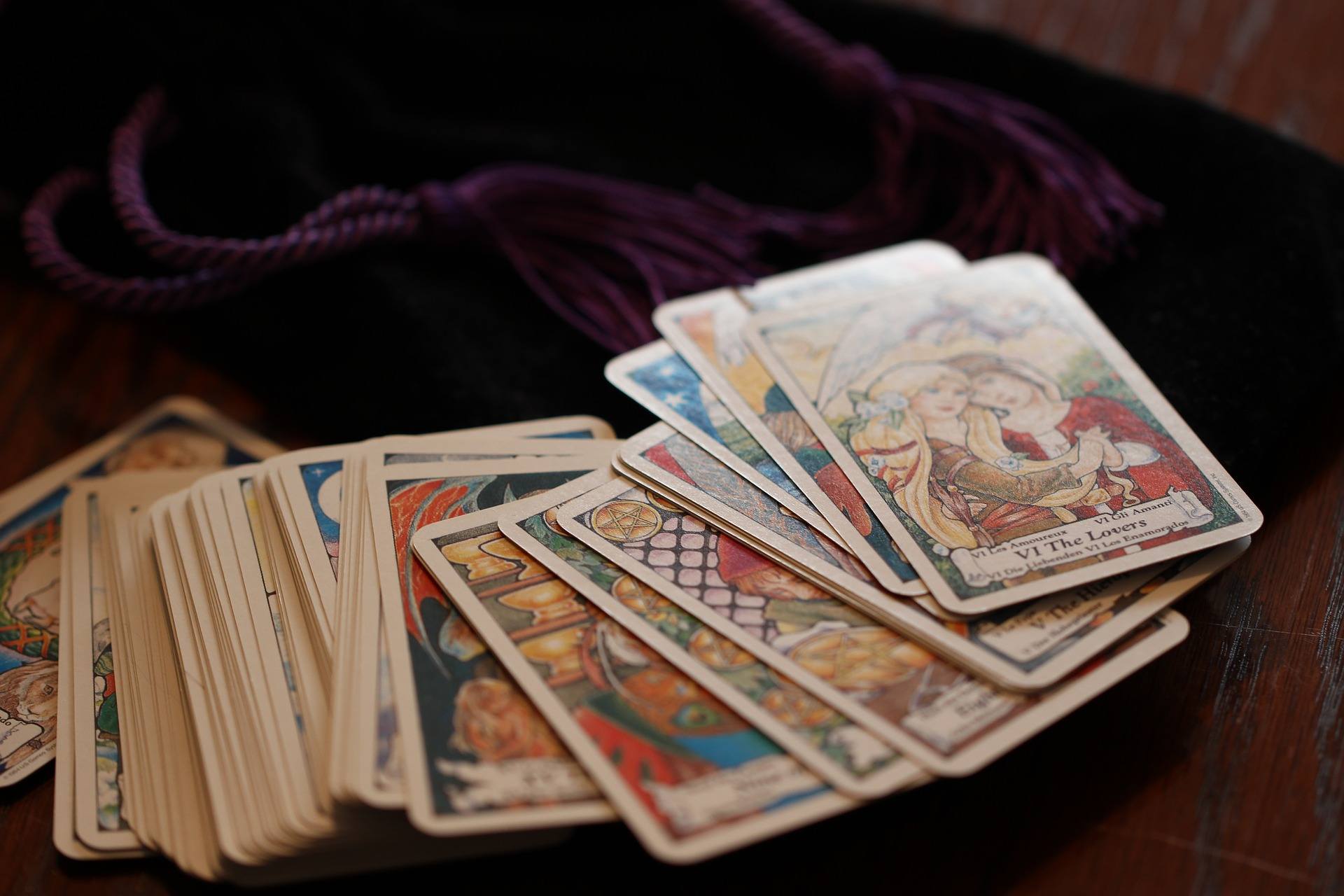 a bunch of playing cards sitting on top of a table