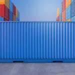 a large blue container sitting in front of many colorful containers