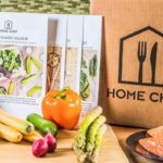 a box of home chef next to some vegetables