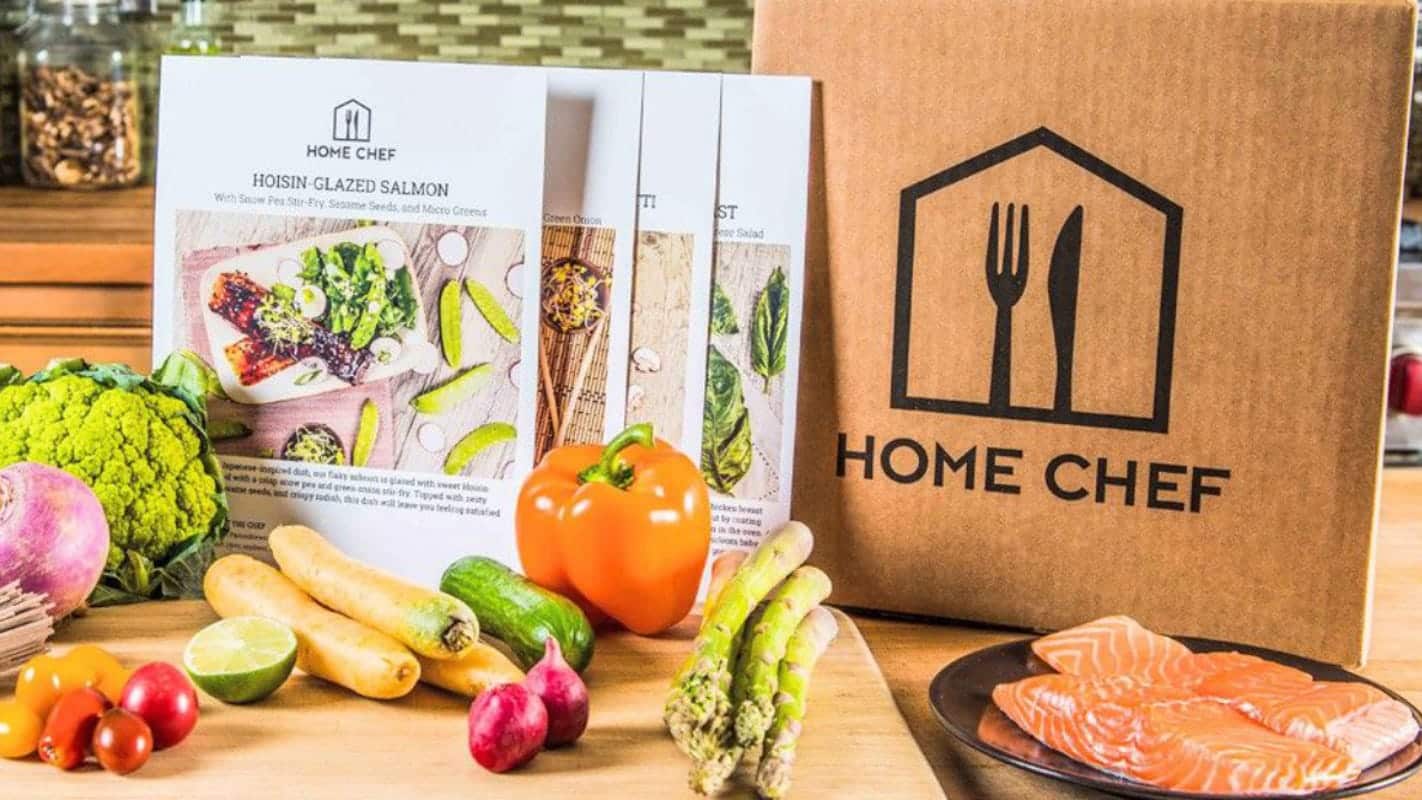 a box of home chef next to some vegetables