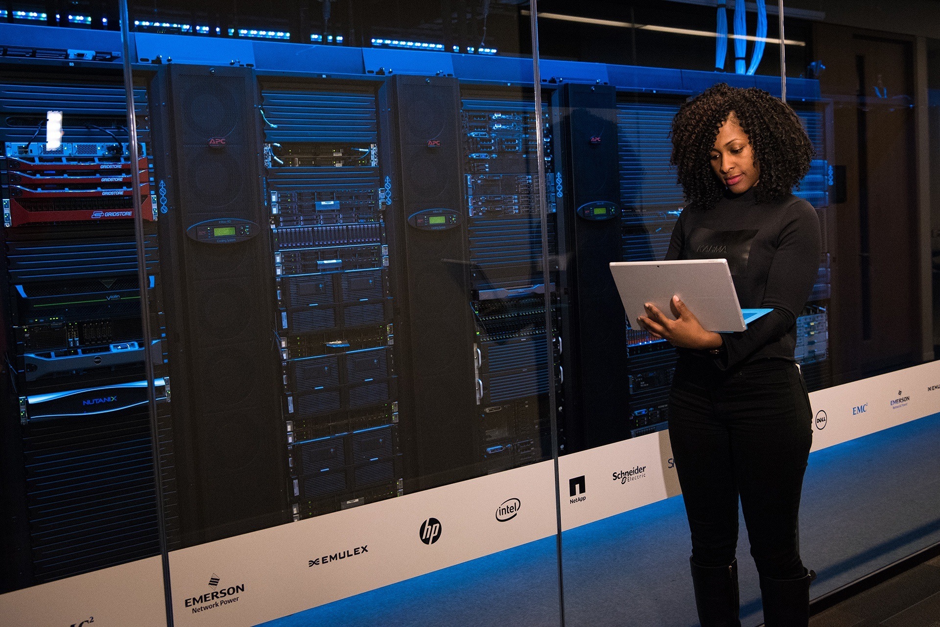 a woman is standing in front of a server